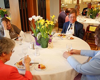 Clockwise from top left, Becky Neuman, Doug Neuman, Billie Neuman, and Jane Porter, all of Niles, eat at the annual Easter Brunch at Fellows Riverside Gardens on Sunday. EMILY MATTHEWS | THE VINDICATOR