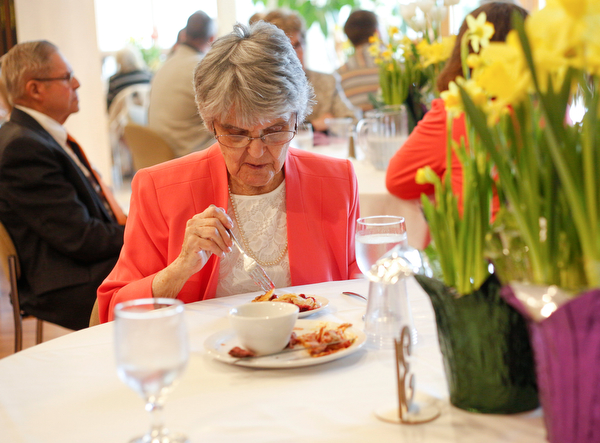Jane Porter, of Niles, eats at the annual Easter Brunch at Fellows Riverside Gardens on Sunday. Her daughter, Billie Neuman, said this is Porter's 95th Easter. EMILY MATTHEWS | THE VINDICATOR