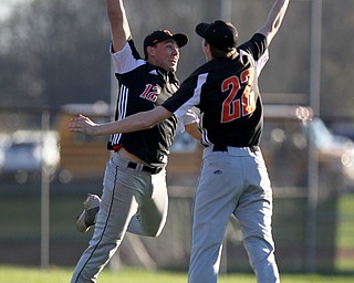 Springfieldâ€™s Shane Eynon (12) and Drew Clark (22) celebrate a 3-1 victory over Western Reserve on Monday afternoon at Springfield Local High School.    Dustin Livesay  |  The Vindicator  4/22/19  Springfield Local