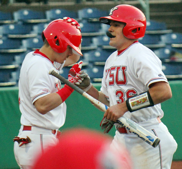 William D. Lewis the vindicator  YSU's Dylan Swarmer(36) gets congrats from Lucas Nasonti(1) after scoring during 8th inning of 4-23-19 game with OU.