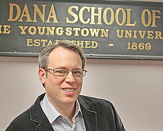 Randall Goldberg, director of the Dana School of Music at YSU, stands in the Dana School’s administrative offices. The school celebrates its 150th anniversary with a gala.