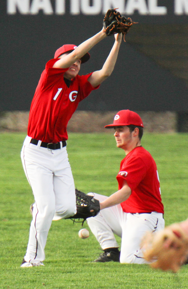William D. Lewis The Vindicator  Girard's Justin Creech(1) and Brady .Hunkus(9) try to catch a fly ball off the bat of Ursuline's Jak Friesen during 4-24-19 game at Cene.