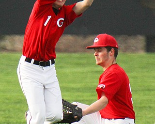 William D. Lewis The Vindicator  Girard's Justin Creech(1) and Brady .Hunkus(9) try to catch a fly ball off the bat of Ursuline's Jak Friesen during 4-24-19 game at Cene.