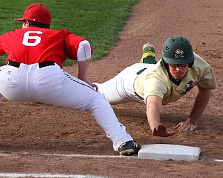 William D. Lewis The VindicatorvUrsuline's Jake Freisen dives back to first as Girard;s Nick DeGregory(6) waits for the throw during 4-24-19 game  at Cene.