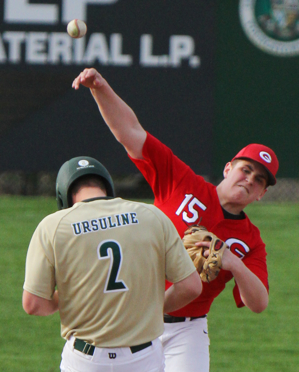 William D. Lewis The Vindicator  Girard's Andrew Delgarbino(15) tries to turn a double play as Ursuline's Jqke Freisen(2) is out at 2nd during 4-24-19 game at Cene.
