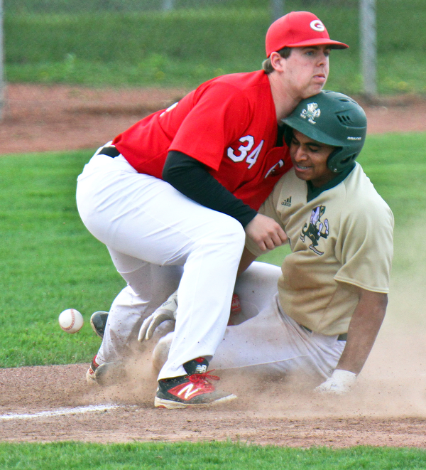 William D. Lewis The Vindicator  Girard 3rd baseman Matt Miles(34) loses control of the ball as Ursuline's Dante Walker(27) is safe at 3rd during 4-24-19 game  at Cene.
