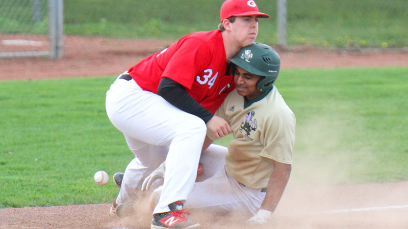 Girard third baseman Matt Miles (34) loses control of the ball as Ursuline's Dante Walker (27) is safe at third during Wednesday's  game at Cene park