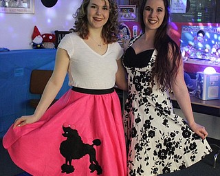 Neighbors | Abby Slanker.C.H. Campbell Elementary School students could visit the school library for a lesson in popular 1950s dances from Youngstown State University students Emily McConnell (left) and Kaitlynn Kurdziel (right) during the school’s annual Spring Fest sock hop on March 22.