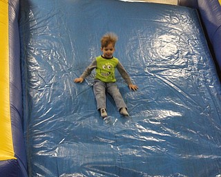 Neighbors | Abby Slanker.An attendee of the C.H. Campbell Elementary School Spring Fest had a hair raising experience on the inflatable slide set up in the gym on March 22.