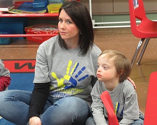 Neighbors | Jessica Harker.Kindergarten teacher Candace Wright sat with Liam Levendosky March 21 as students watched a video for World Down Syndrome Day.