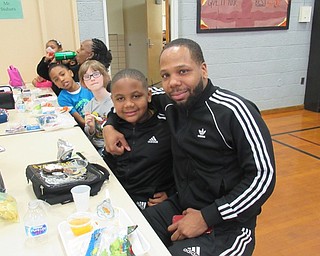 Neighbors | Jessica Harker.Delonte Carter Jr and Delonte Carter Sr enjoyed lunch together on March 21 at West Boulevard Elementary's special persons lunch for second-graders.