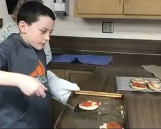 Neighbors | Submitted.Fifth and sixth grade students in Poland learned oven safety during Family Consumer Science class where they made english muffin pizza.