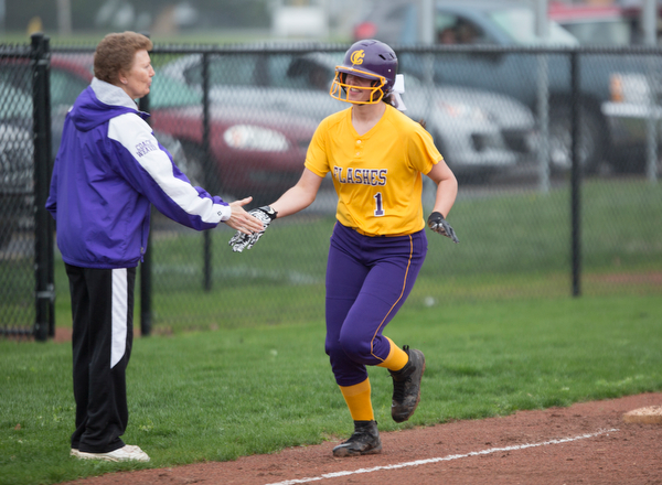 Champion's Emma Gumont high-fives Head Coach Cheryl Weaver after hitting a home run during their game against Crestview at Champion High School on Thursday. Champion won 10-0 with a mercy rule in the fifth inning. EMILY MATTHEWS | THE VINDICATOR