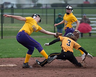 Champion's Emma Gumont tags out Crestview's Haley Eskra during their game at Champion High School on Thursday. Champion won 10-0 with a mercy rule in the fifth inning. EMILY MATTHEWS | THE VINDICATOR