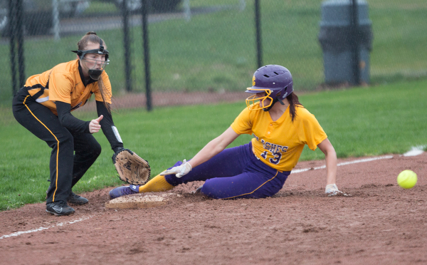 Champion's Abbi Grace slides safely into third before the ball gets to Crestview's Shianna Mathes during their game at Champion High School on Thursday. Champion won 10-0 with a mercy rule in the fifth inning. EMILY MATTHEWS | THE VINDICATOR