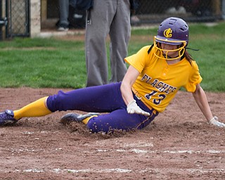 Champion's Abbi Grace slides safely into home to score the game-winning run during their game against Crestview at Champion High School on Thursday. Champion won 10-0 with a mercy rule in the fifth inning. EMILY MATTHEWS | THE VINDICATOR