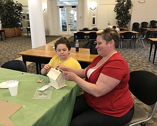 Neighbors | Jessica Harker.Community members used kits to put together different birdhouses at the Austintown library for the first Build a Birdhouse event.