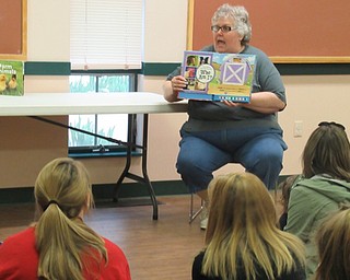 Neighbors | Jessica Harker.Brenda Markley, a naturalist at the Mill Creek MetroParks Farms, read a story at a recent Tales for Tots event. The event featured baby animals, several of which were able to be held and petted.