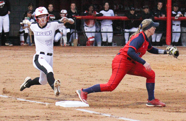 William D. Lewis The Vindicator YSU's Lexi Zappitelli(23) is out as 1rst  as UIC's Emily Wetzel(9) makes the catch during 4-26-19 game with UIC