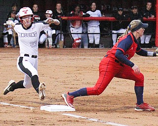 William D. Lewis The Vindicator YSU's Lexi Zappitelli(23) is out as 1rst  as UIC's Emily Wetzel(9) makes the catch during 4-26-19 game with UIC