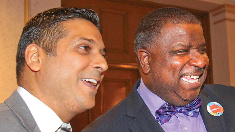 Youngstown City Schools CEO Krish Mohip, left, and Youngstown Mayor Jamael Tito Brown share a light moment during Friday night’s gala at Stambaugh Auditorium. The district’s 13th annual Title I Parent Conference celebrated the positive relationships parents have with the district.