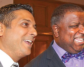 Youngstown City Schools CEO Krish Mohip, left, and Youngstown Mayor Jamael Tito Brown share a light moment during Friday night’s gala at Stambaugh Auditorium. The district’s 13th annual Title I Parent Conference celebrated the positive relationships parents have with the district.