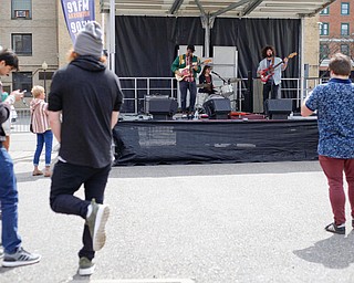 People watch the Dreemers perform at the Summit's 330 Stage during Federal Frenzy on Saturday. EMILY MATTHEWS | THE VINDICATOR