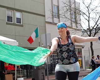 Kelsi Owen, of Niles and with the hula hoop performance troupe Infini-Tribe, dances with silk fans at Federal Frenzy on Saturday. EMILY MATTHEWS | THE VINDICATOR