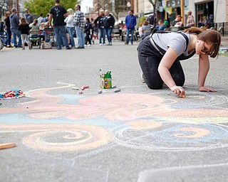 Rachel Hritz, a freshman studying art education and painting at Youngstown State University, draws an octopus with chalk at Federal Frenzy on Saturday. EMILY MATTHEWS | THE VINDICATOR