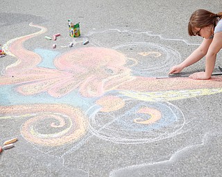 Rachel Hritz, a freshman studying art education and painting at Youngstown State University, draws an octopus with chalk at Federal Frenzy on Saturday. EMILY MATTHEWS | THE VINDICATOR