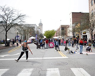 Kelsi Owen, of Niles and with the hula hoop performance troupe Infini-Tribe, dances with a hula hoop at Federal Frenzy on Saturday. EMILY MATTHEWS | THE VINDICATOR