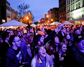 Alison Green, center front, of Boardman, sings along as she and the crowd watch and listen to Spirit of the Bear perform at Penpro Main Stage during Federal Frezny on Saturday night. EMILY MATTHEWS | THE VINDICATOR