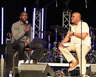 Michael Vick (left) answered questions asked to him by Pastor Gary Frost at  the Mens Rally in the Valley on Saturday morning at the Covelli Center in downtown Youngstown.   Dustin Livesay  |  The Vindicator  4/27/19 Covelli Center