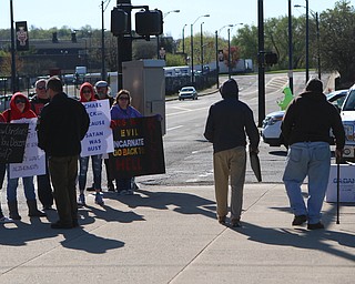 Protestors held signs outside of the Covelli Center in objection to Michael Vick speaking at  the Mens Rally in the Valley on Saturday morning at the Covelli Center in downtown Youngstown.   Dustin Livesay  |  The Vindicator  4/27/19 Covelli Center