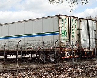 Falcon Transport Co. trucks are parked at the company’s Austintown facility along Victoria Road. The trucking company announced over the weekend it would lay off nearly 600 employees. A notice submitted Monday to Tennessee state offices states its operations in that state would close permanently. A similar notice has not been filed in Ohio.