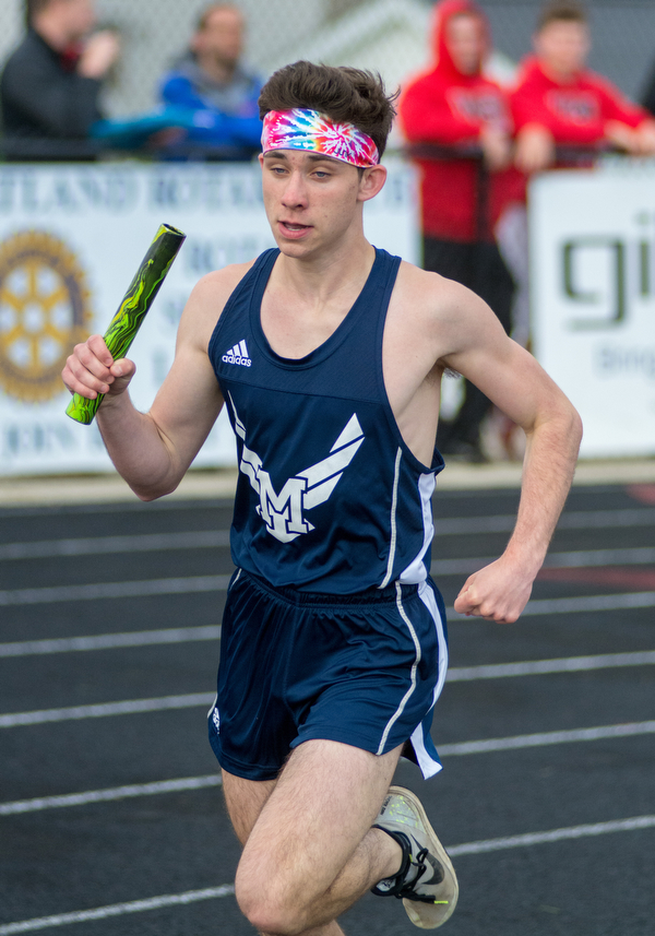 Connor Symbolik of McDonald fights to make up ground in the 3,200-meter relay finals at the Trumbull County Track and Field Meet on Tuesday. The Blue Devils claimed victory in the race.