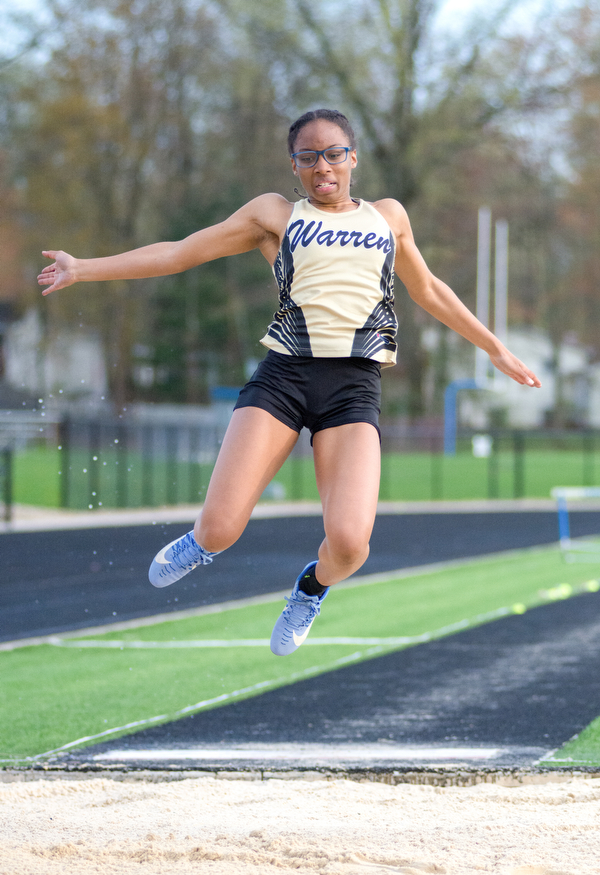 Diamond Phillips of Warren G. Harding soars to the win in the long jump at the Trumbull County Track and Field Meet on Tuesday..?.