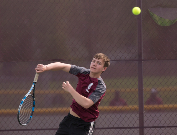 Boardman's Justin Olsen hits the ball back to Ursuline's Greg Morgione during their match at Boardman on Wednesday. EMILY MATTHEWS | THE VINDICATOR