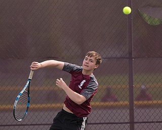 Boardman's Justin Olsen hits the ball back to Ursuline's Greg Morgione during their match at Boardman on Wednesday. EMILY MATTHEWS | THE VINDICATOR