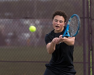 Ursuline's Greg Morgione hits the ball back to Boardman's Justin Olsen during their match at Boardman on Wednesday. EMILY MATTHEWS | THE VINDICATOR