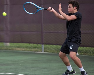 Ursuline's Greg Morgione hits the ball back to Boardman's Justin Olsen during their match at Boardman on Wednesday. EMILY MATTHEWS | THE VINDICATOR