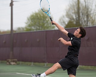 Ursuline's Greg Morgione hits the ball back to Boardman's Justin Olsen during their match at Boardman on Wednesday. EMILY MATTHEWS | THE VINDICATOR