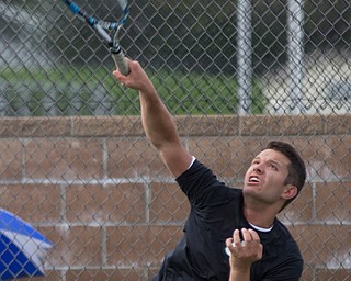 Ursuline's Luke Tsudis serves the ball to Boardman's Andy Beichner during their match at Boardman on Wednesday. EMILY MATTHEWS | THE VINDICATOR