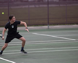 Ursuline's Austin Arfaras hits the ball back to Boardman's Peyton Curtis during their match at Boardman on Wednesday. EMILY MATTHEWS | THE VINDICATOR