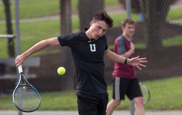 Ursuline's Greg Morgione hits the ball back to Boardman's Justin Olsen during their match at Boardman on Wednesday. EMILY MATTHEWS | THE VINDICATOR