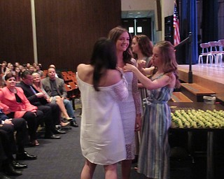 Neighbors | Jessica Harker.Austintown High School junior and senior inductees in NHS recieved roses pinned by members of the group April 12 at the schools NHS induction.