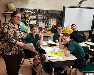 Neighbors | Submitted.Tracie Balentine taught a lesson to a group of seventh-grade students as part of Junior Achievement at Holy Family. Pictured are, from left, Balentine, Dominic Graziano, Joseph Wrenn, JD Memo and William Desmond.