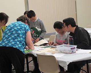 Neighbors | Jessica Harker.Children's librarian Karen Saunders assisted community members in creating their own storyboards made from felt on April 19 at the Boardman library.