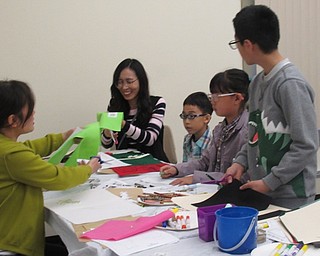 Neighbors | Jessica Harker.Community members traced figures for various stories onto felt for their own felt storyboards on April 19 at the Boardman library.