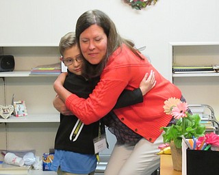 Neighbors | Jessica Harker.In celebration of Administration Appreciation Day principal for the day Aiden McDonald presented a flower pot to Poland Union Preschool's seceratary Dianna Weaver April 24.